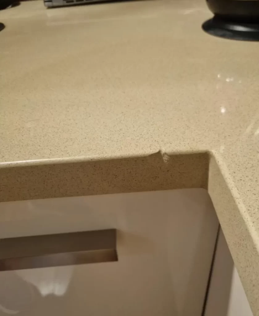 stone benchtop with chip damage